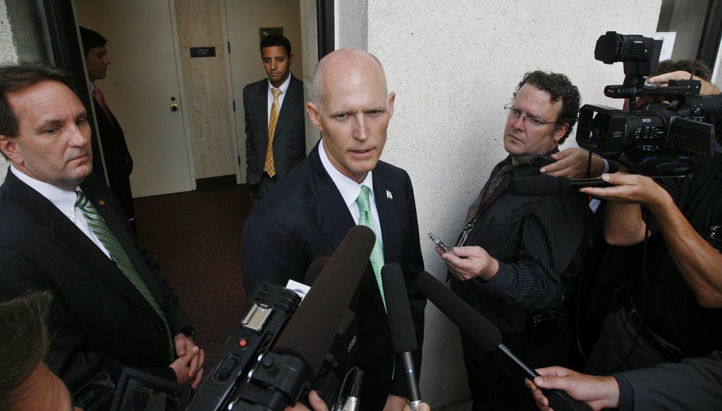 Rick Scott speaks with reporters during the final week of his first legislative session.