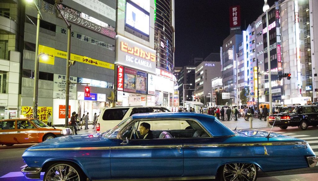 A man drives a 1962 Chevy Impala in Shibuya, a ward of Tokyo, Japan on Oct. 30, 2015.  (Eve Edelheit | Tampa Bay Times)