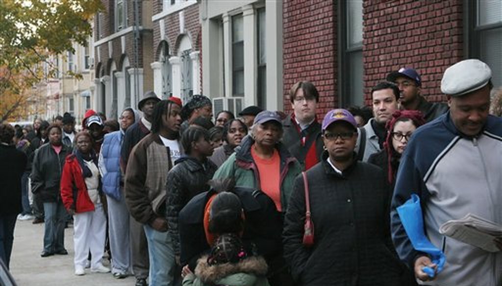 In this Nov. 4, 2008 file photo, voters, many waiting more than an hour before the P.S. 92 polling site opened, stand in a line that snaked nearly three blocks in the Flatbush section of Brooklyn, New York. (AP)