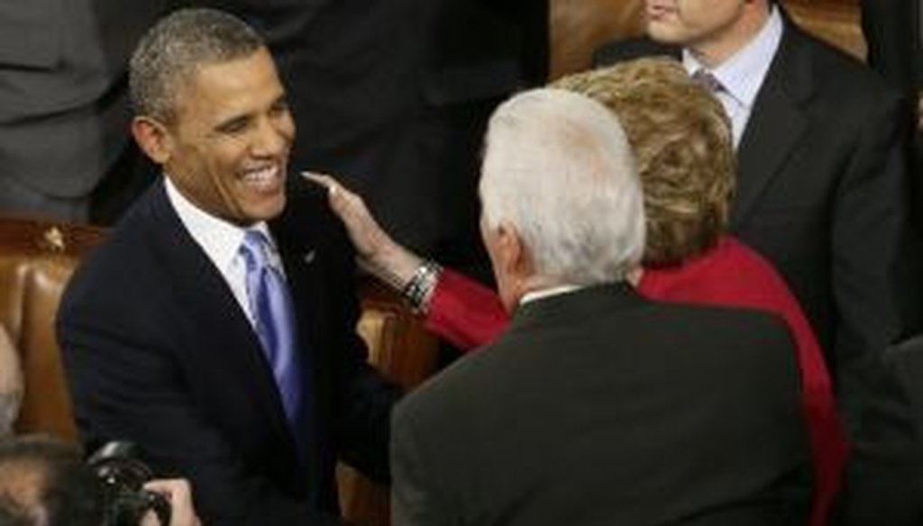 President Barack Obama greets well-wishers in the House chamber before giving his State of the Union address on Jan. 28, 2014.