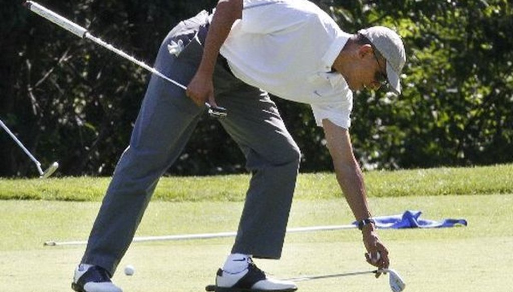 President Barack Obama golfs at Farm Neck Golf Club in Oak Bluffs, Mass., on the island of Martha's Vineyard, on Aug. 9, 2014. 