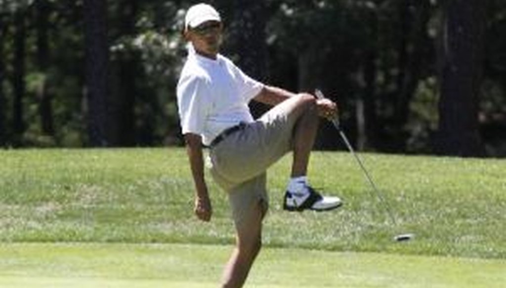President Barack Obama reacts as he misses a shot while golfing at Farm Neck Golf Club in Oak Bluffs, Mass., on the island of Martha's Vineyard, Aug. 11, 2013. (Associated Press)