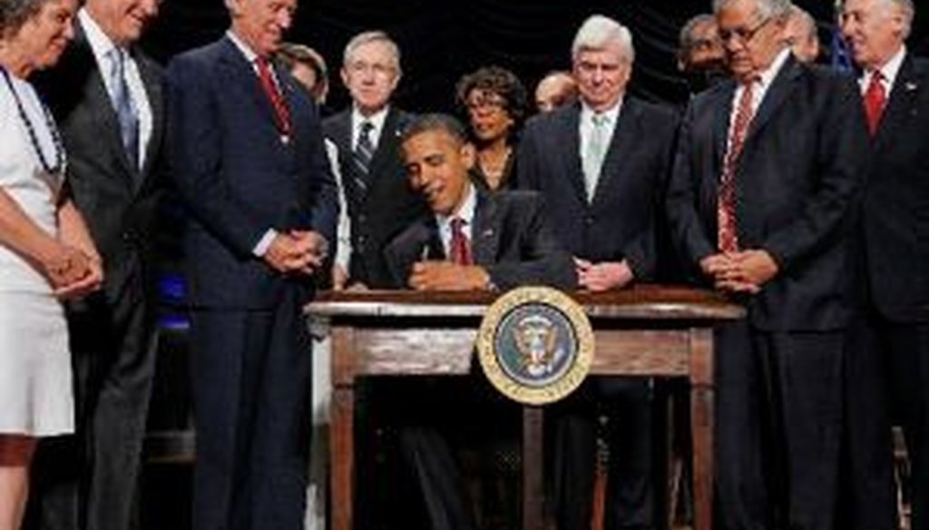President Obama signs new financial regulations into law on Wednesday.