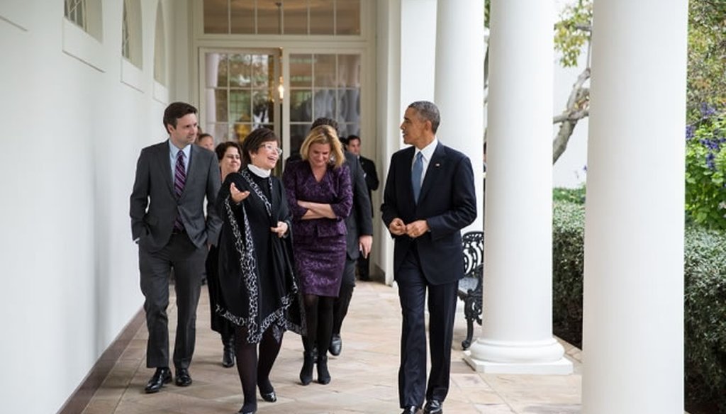 President Barack Obama walks with his advisers the day after Republicans won control of the Senate. (White House photo)