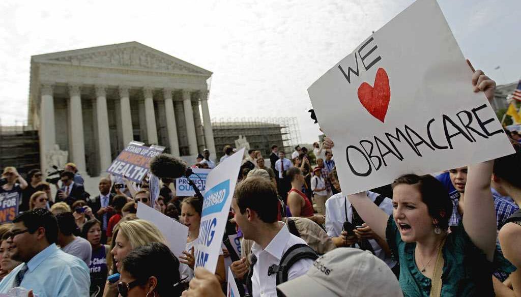 Supporters of the health care reform law celebrate June 28, 2012, outside the Supreme Court in Washington. 