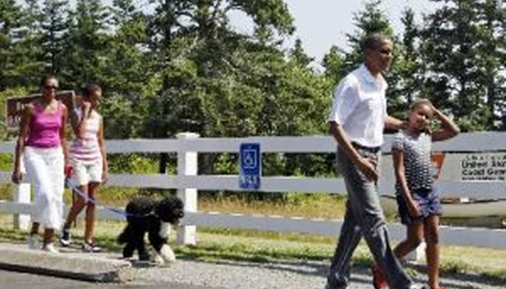 President Barack Obama, first lady Michelle Obama, daughters Malia and Sasha, and dog Bo in Bar Harbor, Maine, on July 17, 2010.