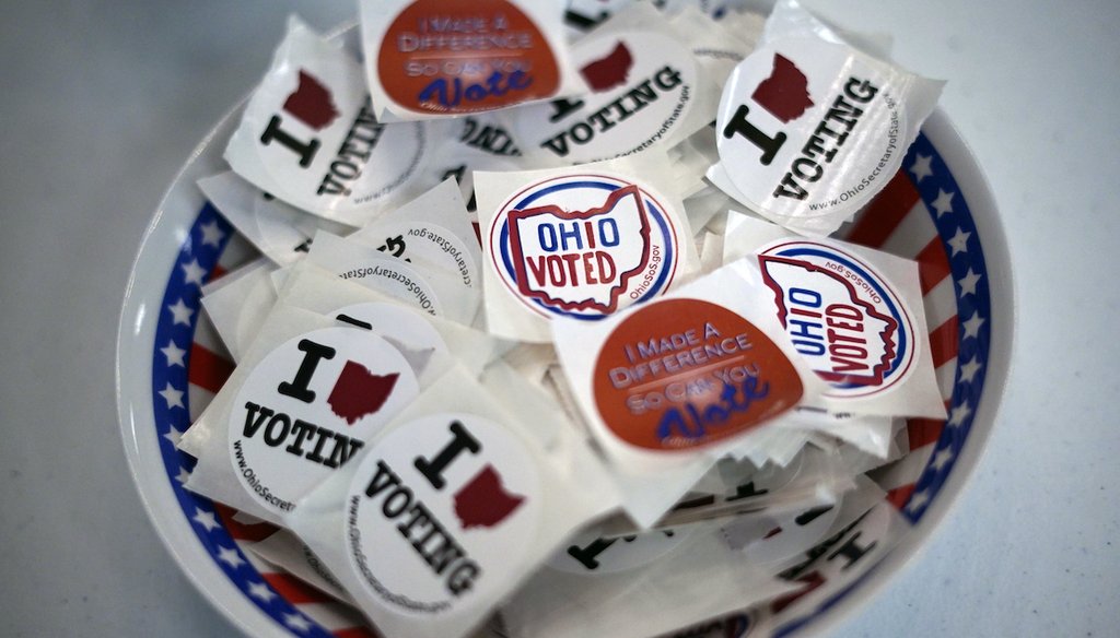 A bowl of stickers waits for voters after they cast their early ballot at the Jefferson County Board of Elections office in Steubenville, Ohio, on Monday, April 4, 2022. (AP)