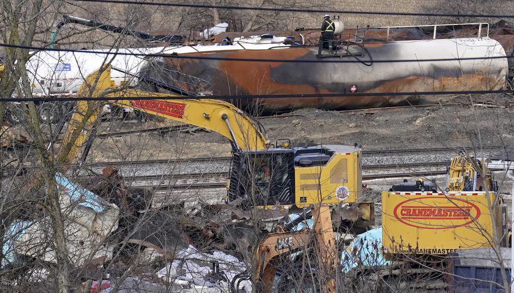 Workers continue to clean up remaining tank cars on Feb. 21, 2023, in East Palestine, Ohio, following the Feb. 3 derailment of a Norfolk Southern freight train. (AP Images)