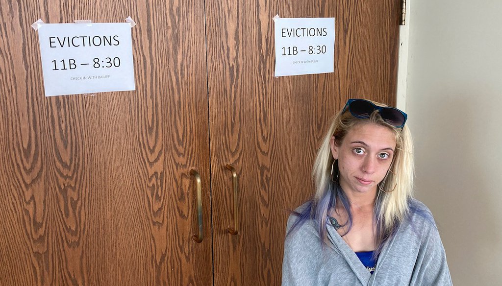 Chelsea Rivera, 27, stands outside Franklin County evictions court in Columbus, Ohio. The single mom is behind $2,988 in rent and late fees for the one bed-room apartment she rented for herself and her three young sons. (AP Photo/Andrew Welsh-Huggins)