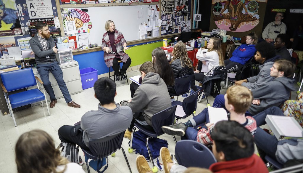In this 2019 photo, students listen as social studies teachers lead the introductory class of their American Thought and Political Radicalism course at Worthington High School in Ohio. (AP Photo/John Minchillo)