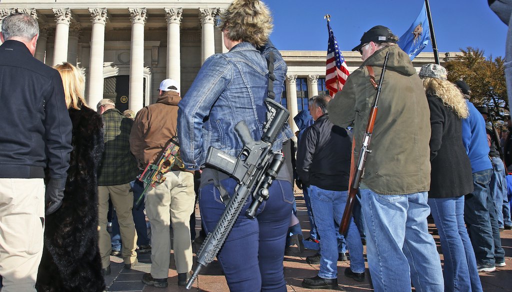Leslie Nessmith, center, of Edmond, Okla., attends a rally at the state Capitol to mark the start of a new law that allows most adults in Oklahoma to carry a firearm in public without a background check or training, Nov. 1, 2019, in Oklahoma City. (AP)