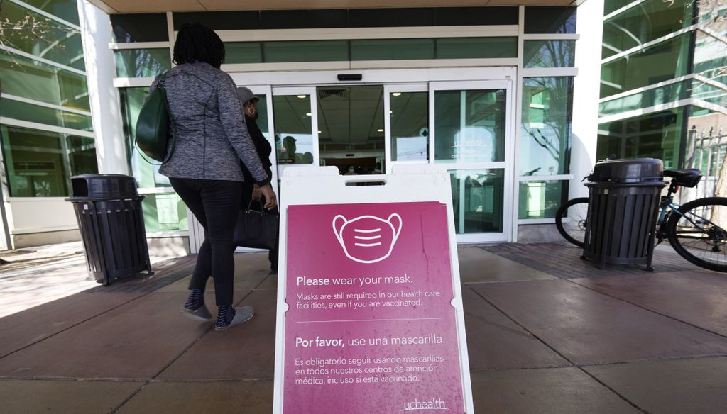 A sign advising visitors to wear face coverings outside UCHealth University of Colorado hospital on April 1, 2022, in Aurora, Colo. (AP)