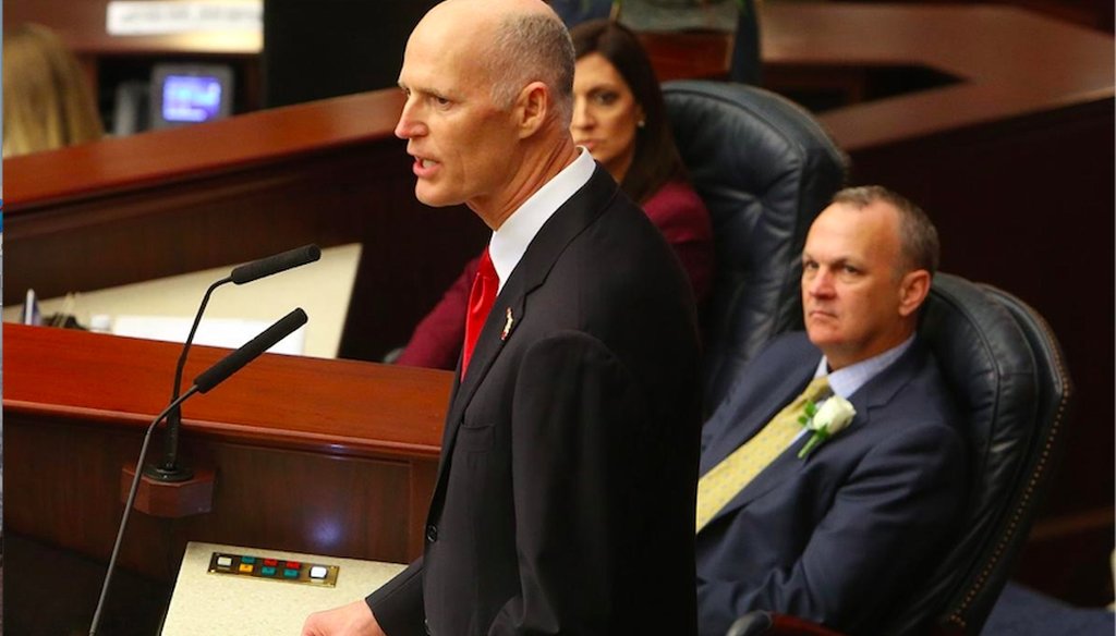 Florida Gov. Rick Scott addresses a joint session of the Florida Legislature while House Speaker Richard Corcoran, R-Land O' Lakes, watches.  (Tampa Bay Times)