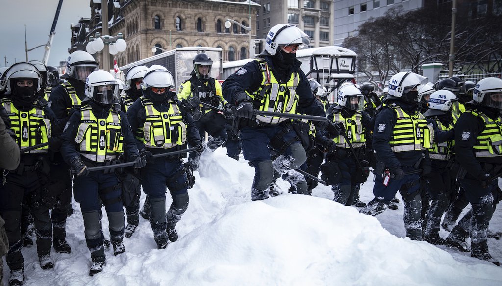Police move in to clear protesters from downtown Ottawa near Parliament hill on Saturday, Feb. 19, 2022. Police arrested more than 100 and towed vehicles, raising authorities’ hopes for an end to the three-week protest. (AP)