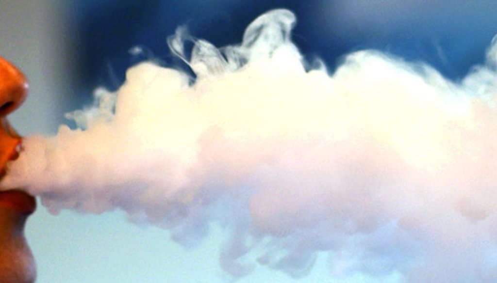 An electronic cigarette user blows some smoke. (AP file photo)