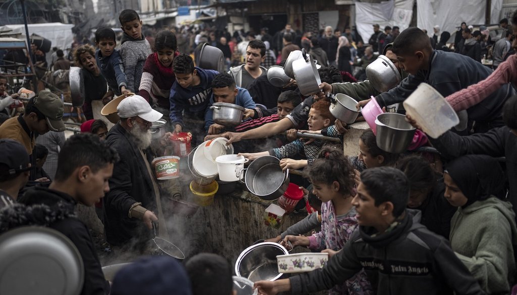 Palestinians line up for a free meal in Rafah, Gaza Strip, Dec. 21, 2023. International aid agencies say Gaza is suffering from shortages of food, medicine, and other essential supplies as a result of the war between Israel and Hamas. (AP)