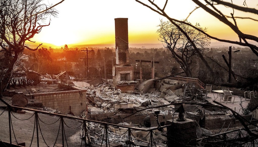 The sun rises behind a home destroyed by the Palisades Fire in the Pacific Palisades community of Los Angeles, Jan. 12, 2025. (AP)