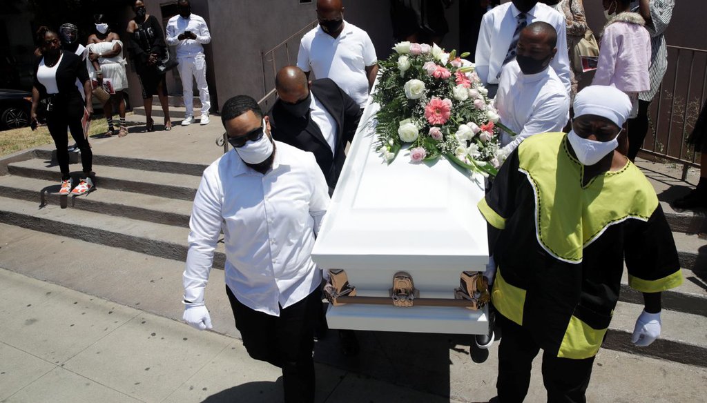 Pallbearers carry a casket with the body of Lydia Nunez, who died from COVID-19, after a funeral service in Los Angeles on July 21, 2020. (AP)