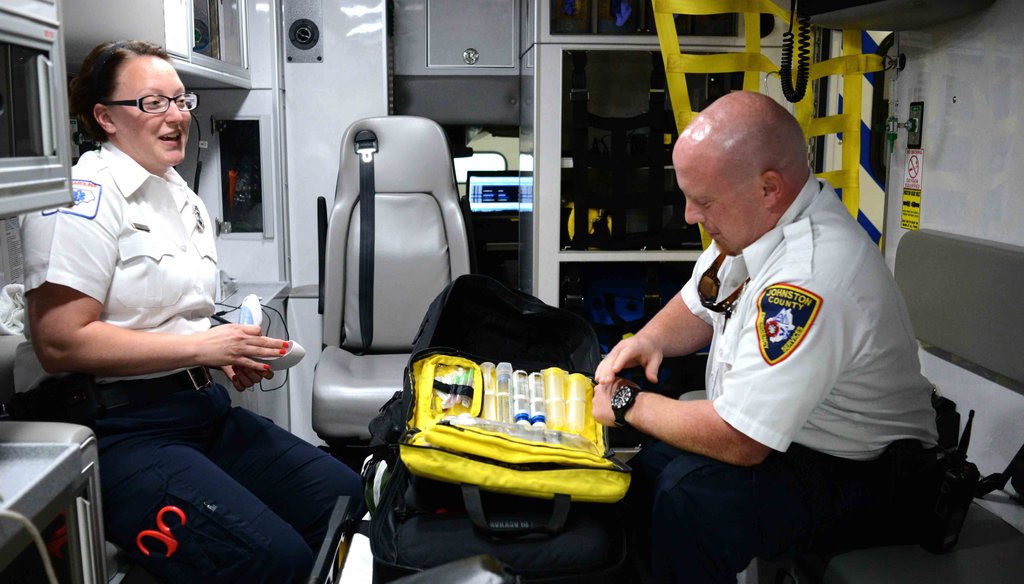 Two North Carolina paramedics show their naloxone, a substance that can reverse an opioid overdose.