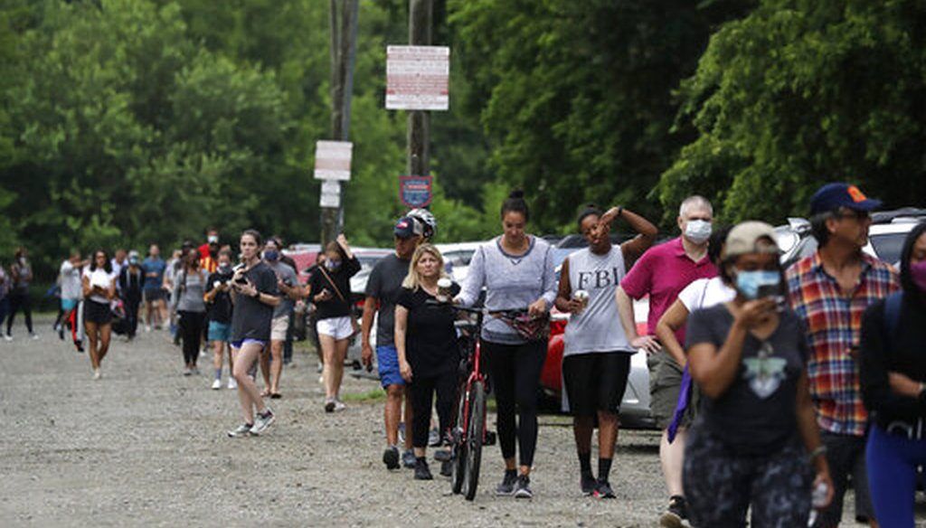 People wait in line to vote in the Georgia's primary election at Park Tavern on Tuesday, June 9, 2020, in Atlanta. (AP)