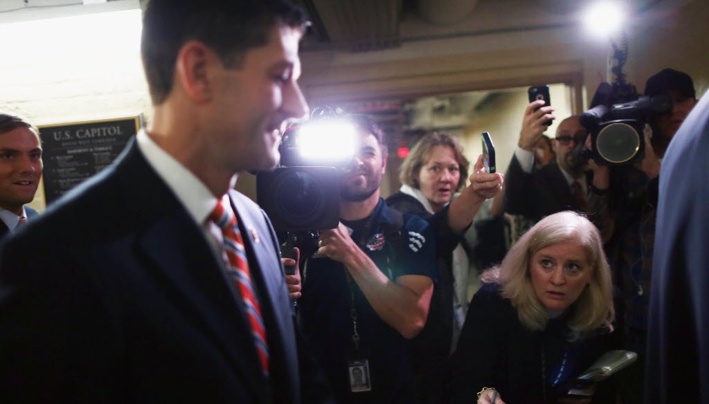 Reporters shouted questions at House Ways and Means Committee Chairman Paul Ryan as he headed for a House Republican caucus meeting in the basement of the U.S. Capitol on Oct. 9, 2015. (Getty Images photo)
