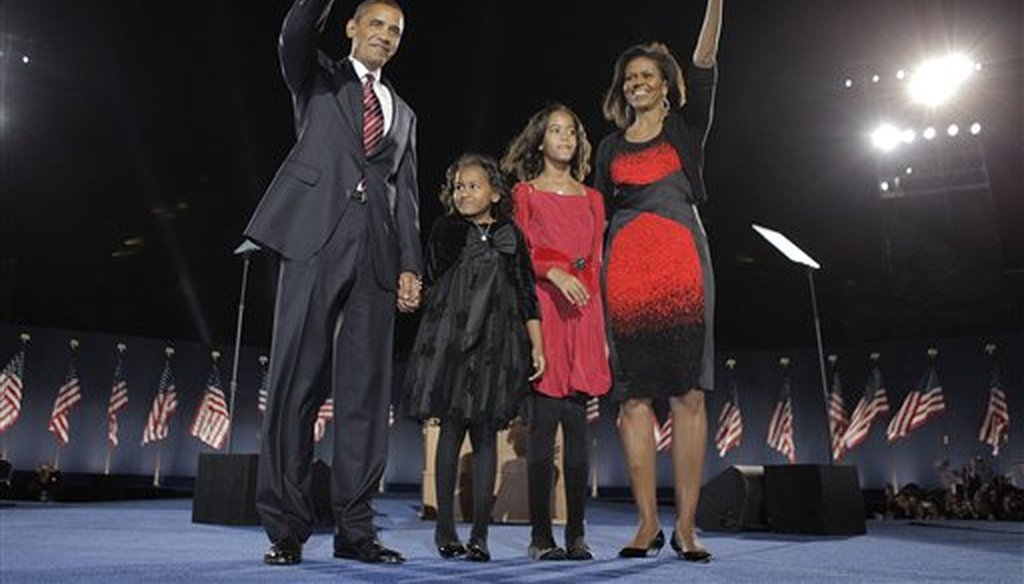 President Barack Obama with his wife Michelle Obama and his two daughters, Sasha and Malia, at an election night rally in Chicago on Nov. 4, 2008. (AP/Hong)