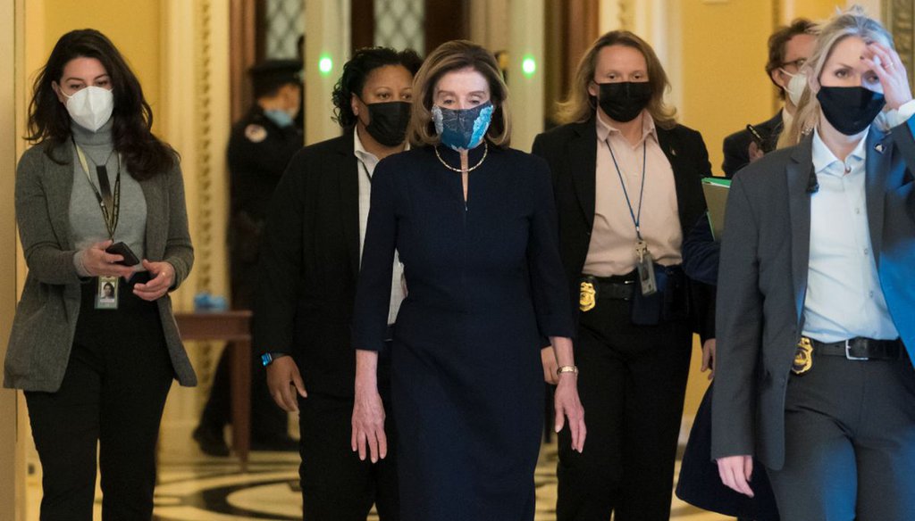House Speaker Nancy Pelosi, D-Calif., returns to her leadership office after opening debate on the second impeachment of President Donald Trump on Jan. 13 2021. (AP)