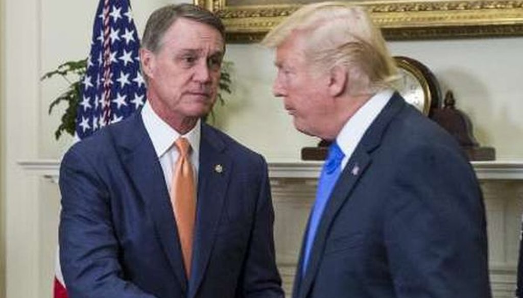 President Donald Trump shakes hands with Sen. David Perdue, R-Ga., at the White House on August 2, 2017. (Zach Gibson-Pool/Getty Images) 