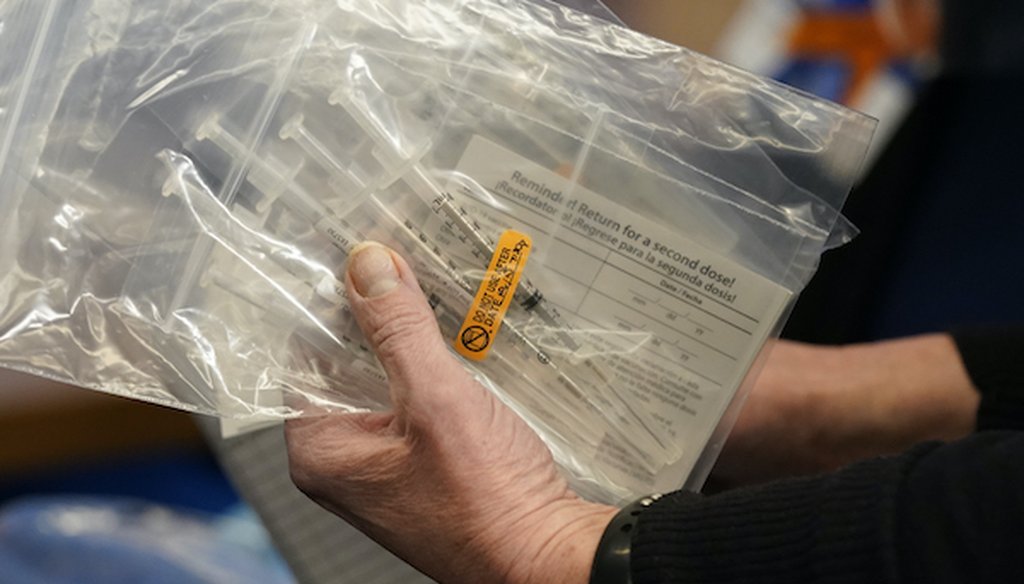 Doses of the Pfizer-BioNTech COVID-19 vaccine are seen at the Beaumont Service Center, Tuesday, Dec. 15, 2020 in Southfield, Mich. (AP Photo/Carlos Osorio)