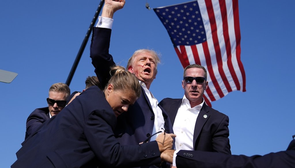 Republican presidential candidate former President Donald Trump is surrounded by U.S. Secret Service agents at a campaign rally, July 13, 2024, in Butler, Pa. (AP)