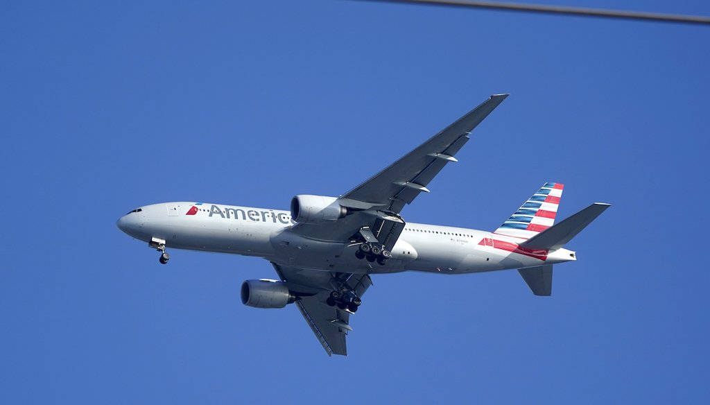 An airplane prepares to land at Miami International Airport on Jan. 27, 2021.