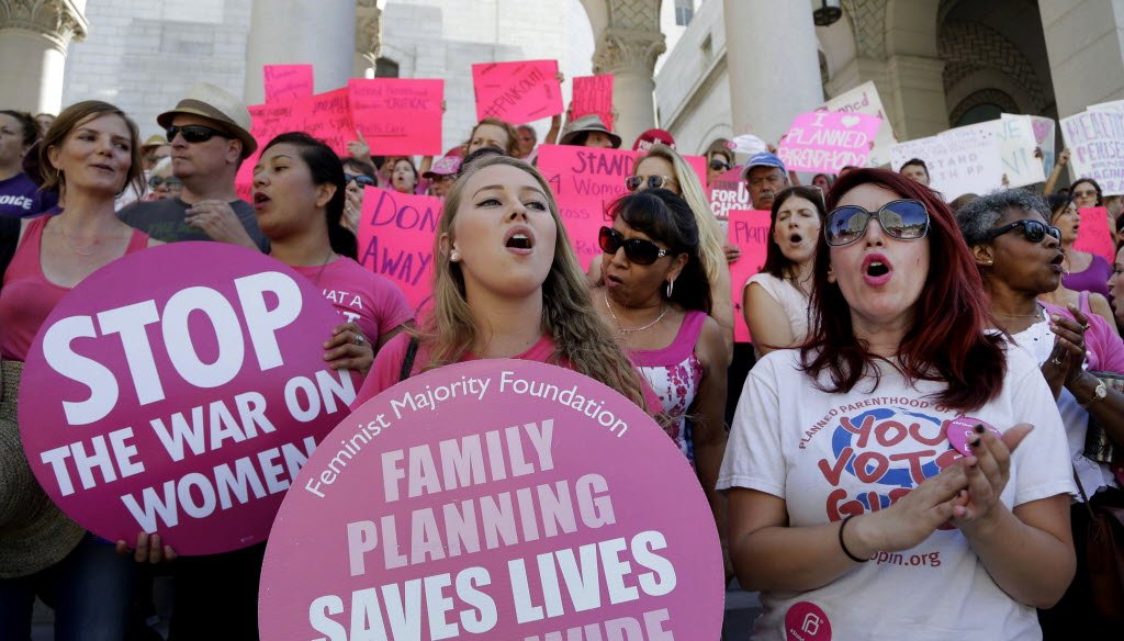 Planned Parenthood supporters rallied at Los Angeles City Hall for women's access to reproductive health care on "National Pink Out Day"' on Sept. 29, 2015. (AP photo)