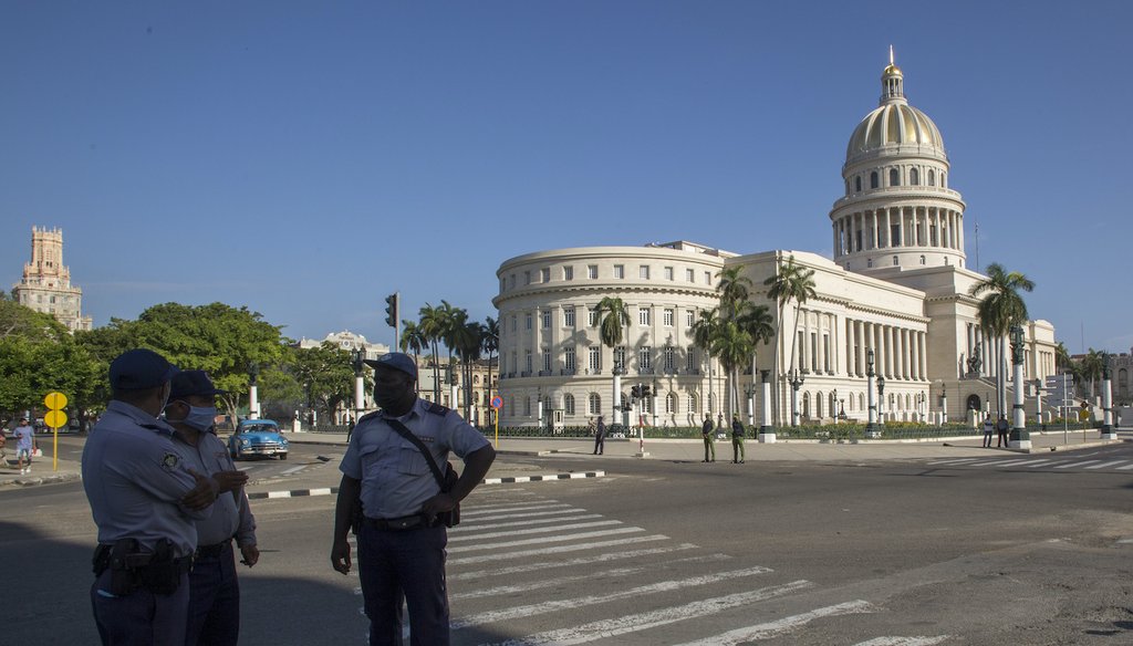 Police stand guard near the National Capitol building in Havana, Cuba, July 12, 2021 (AP)