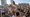 Cece Guida, 19, top, of New York City, pushes on Sam Reddick, 20, of Evansville, Ind., as spring break revelers look on during a game of chicken fight on the beach, Tuesday, March 17, 2020, in Pompano Beach, Fla. (AP)
