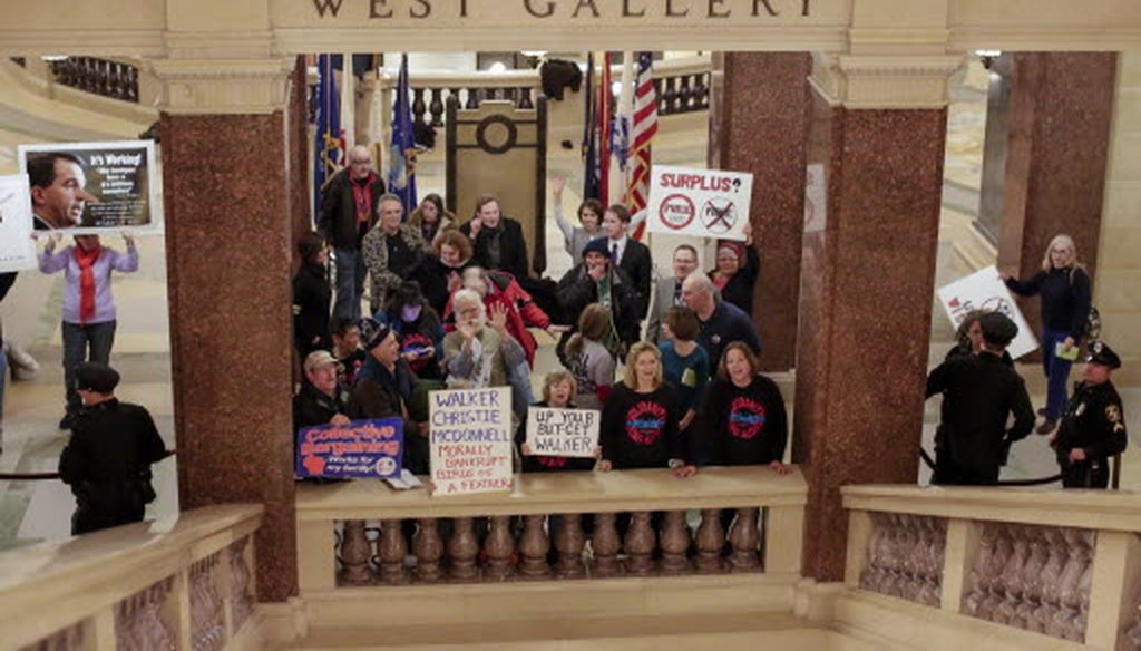 Protesters demonstrated in the Capitol during Gov. Scott Walker's State of the State address on Jan. 22, 2014.