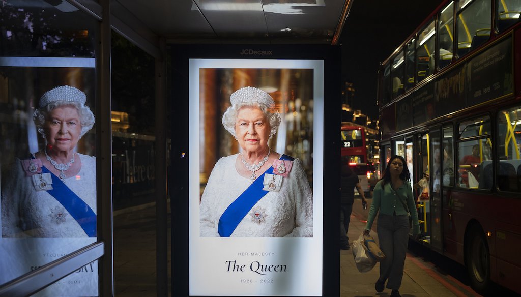 A photo of Queen Elizabeth II is seen at a bus stop in London on Sept. 9, 2022. She died Sept. 8, 2022, at age 96 after 70 years on the throne. (AP)
