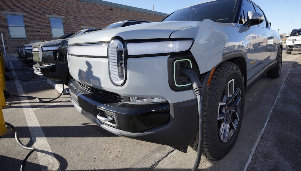 A 2023 Rivian R1T electric pickup truck being charged. (AP)
