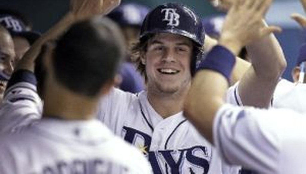 The Tampa Bay Rays' Wil Myers, the American League Rookie of the Year, high-fives his teammates in September.