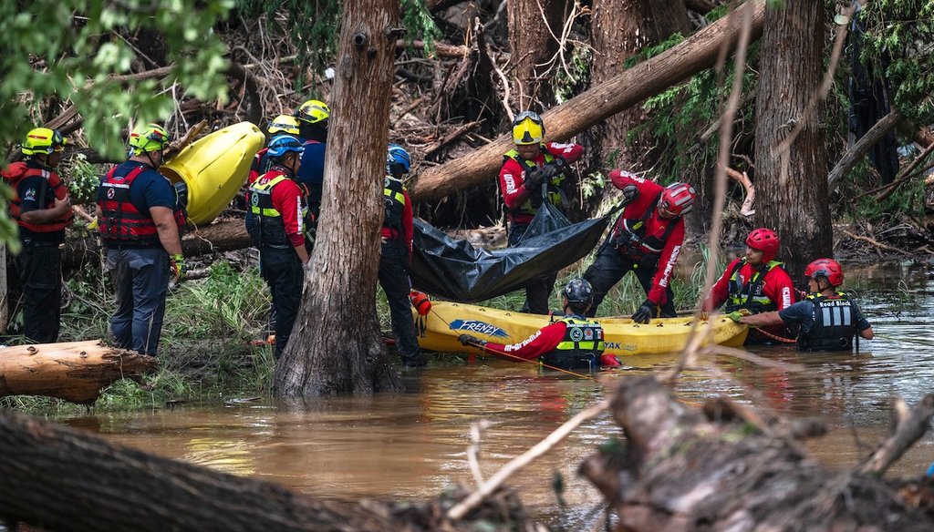 Firefighters from Ciudad Acuña, Mexico, load a body into a raft as they prepare for a water recovery along the Guadalupe River days after a flash flood swept through the area, July 7, 2025, in Ingram, Texas. (AP)
