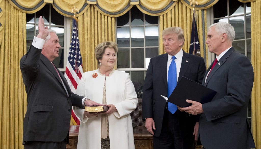 Rex Tillerson (left) is sworn in as secretary of state by Vice President Mike Pence on Feb. 1, 2017, as Tillerson's wife, Renda St. Clair, and President Donald Trump look on. (Getty Images)
