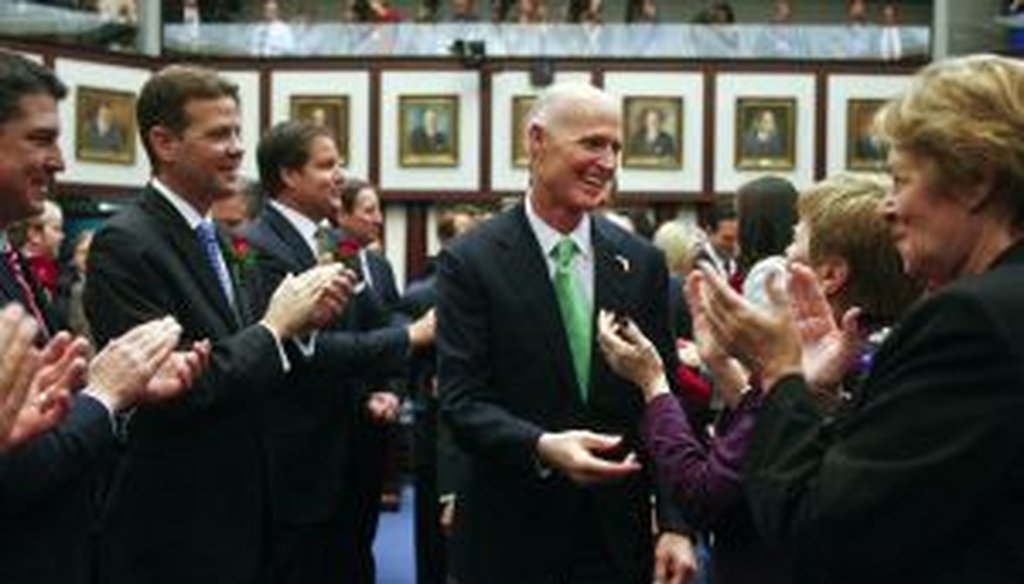 Members of the Legislature greet Rick Scott on March 4, 2014, at the Capitol in Tallahassee, Fla. (AP Photo)