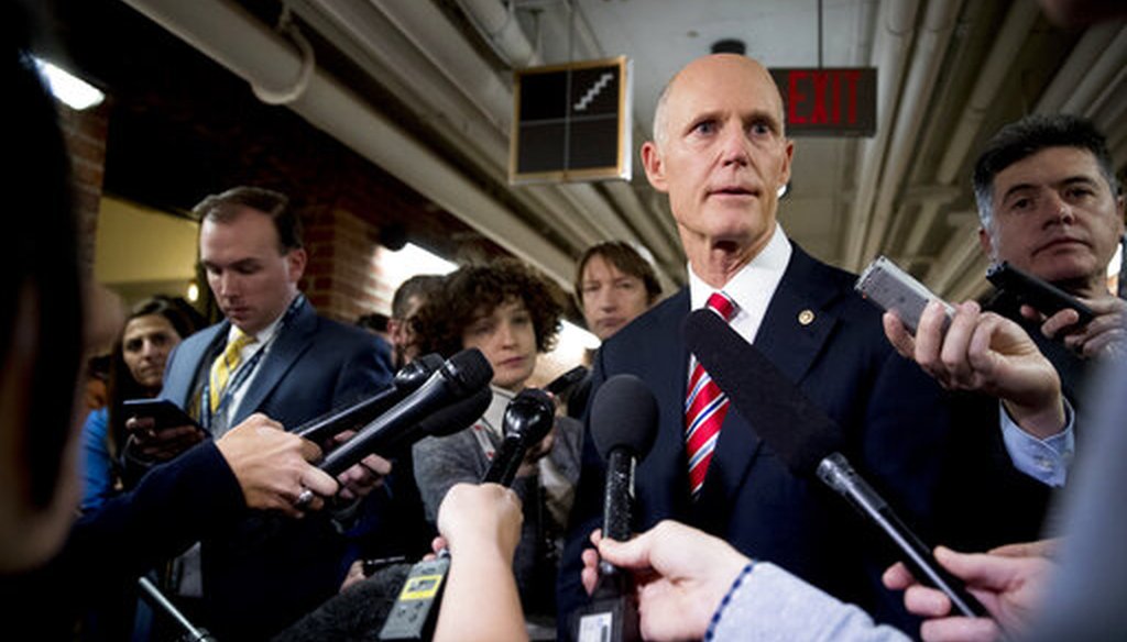 Sen. Rick Scott, R-Fla., speaks to reporters outside his office on Capitol Hill in Washington, Wednesday, Jan. 23, 2019. Scott took questions on Venezuela and the government shutdown. (AP)