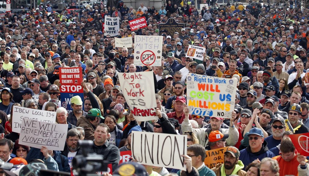 Protesters gathered outside the Indiana Statehouse after the state Senate voted to pass a right to work bill on Feb. 1, 2012. The measure became law and was upheld by the Indiana Supreme Court in November 2014. (AP photo) 