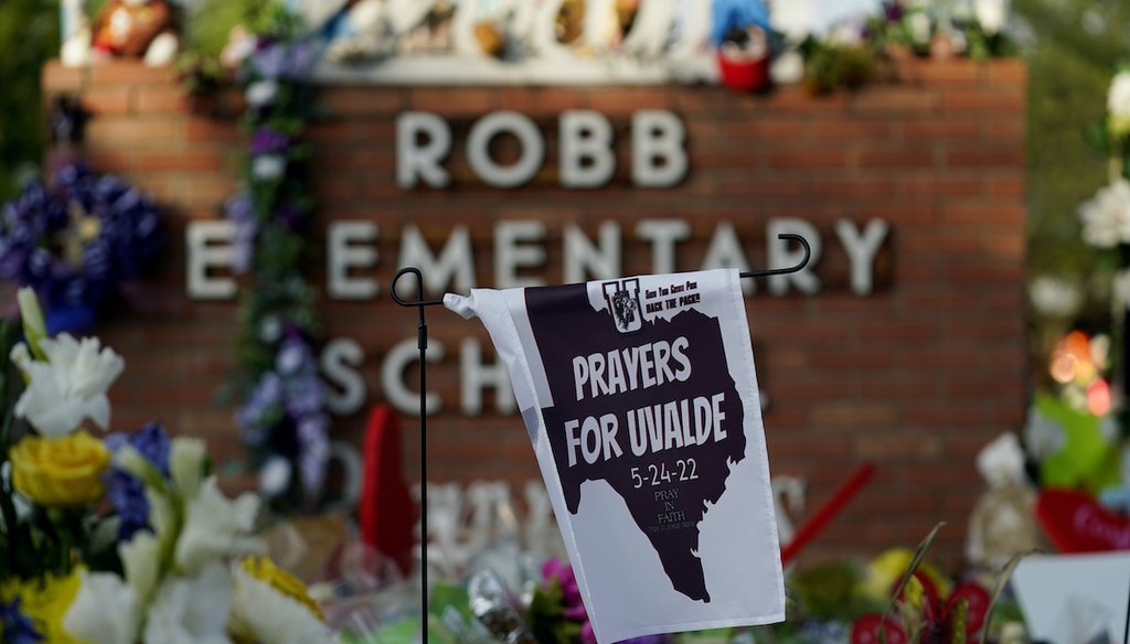 A banner hangs at a memorial outside Robb Elementary School to honor the victims killed in last week's school shooting, Friday, June 3, 2022, in Uvalde, Texas. (AP)