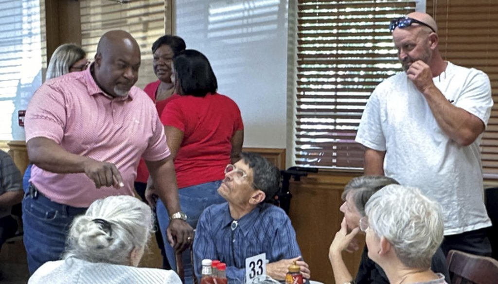 North Carolina Republican gubernatorial candidate Mark Robinson, left, speaks with patrons at the Olympic Family Restaurant in Colfax, N.C., where Robinson held a campaign event on Monday, Aug. 26, 2024. (AP Photo/Gary D. Robertson).