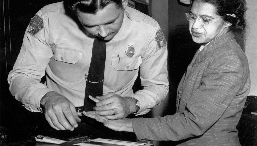 On Feb. 22, 1956, Rosa Parks was fingerprinted by police Lt. D.H. Lackey in Montgomery, Ala., two months after refusing to give up her seat on a bus for a white passenger on Dec. 1, 1955. (AP Photo/Gene Herrick, File)