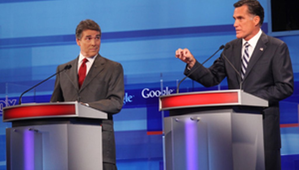 Rick Perry and Mitt Romney spar during the Fox News/Google Republican presidential debate Thursday in Orlando.