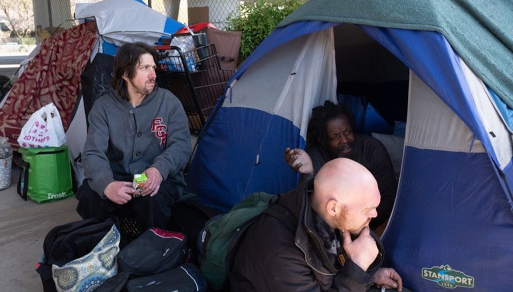 Residents at a homeless encampment in Sacramento in March 2020.  Andrew Nixon / CapRadio