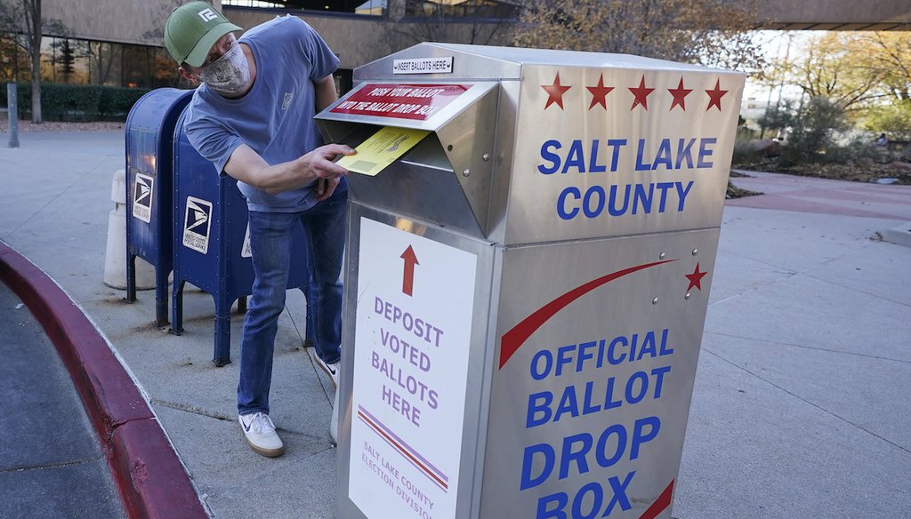 Robert Mabe inserts his ballot into a drop box, Monday, Nov. 2, 2020, in Salt Lake City. (AP)