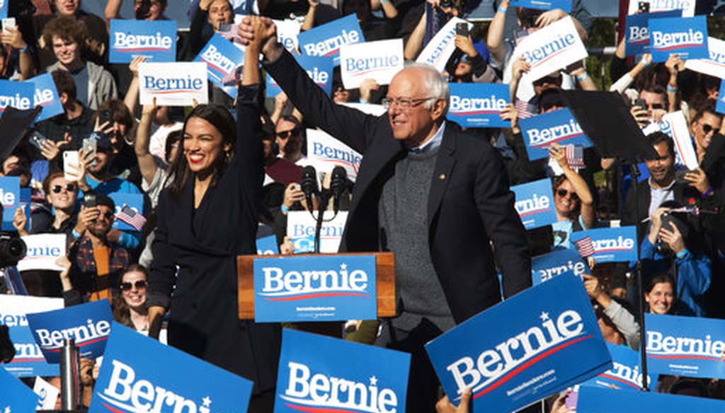 Democratic presidential candidate Sen. Bernie Sanders, I-Vt., right, is introduced by Rep. Alexandria Ocasio-Cortez, D-N.Y., during a campaign rally in New York City. (AP Photo/Mary Altaffer)